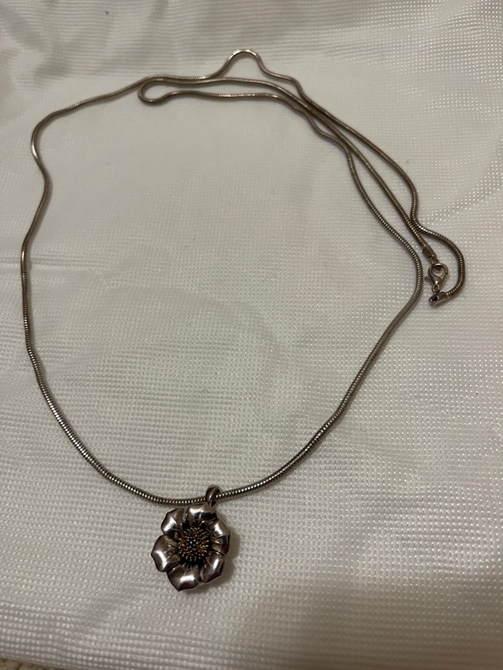 Silver flower necklace patina